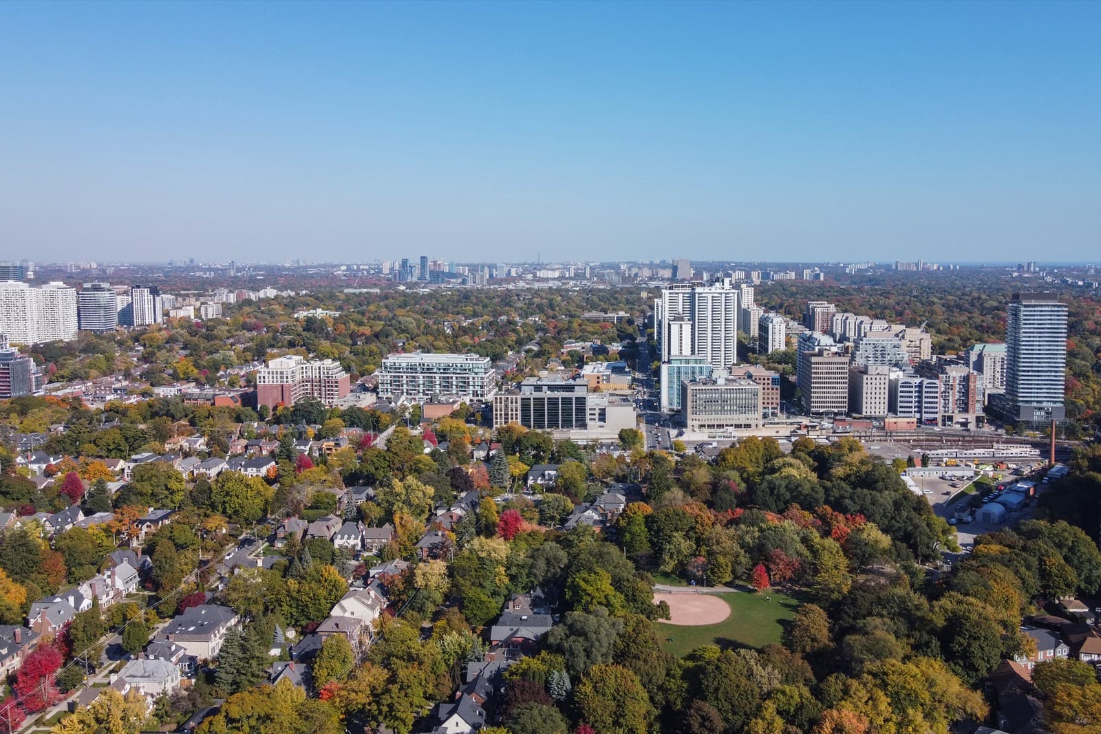 Aerial view of Davisville and Mount Pleasant West condo towers and houses, Toronto